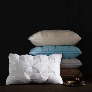 Close-up detail of pleated pillow core showing exquisite twisted pinch design and soft texture.