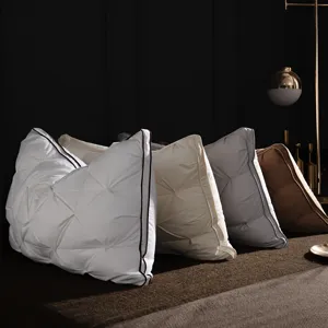 Luxury quilted hotel down pillow detail showcasing fine stitching, premium piping and plush fabric.