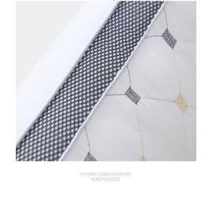 Detailed close-up of hotel pillow core with breathable mesh side and neat quilted pattern.