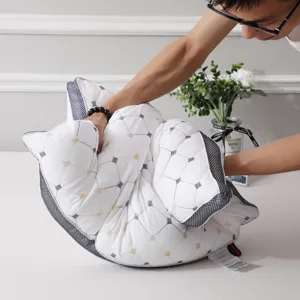 White hotel pillow core with grid pattern and mesh side, resilient and neck support design.