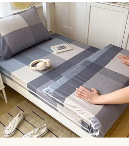 Detail view of plaid cotton bed sheet set, soft texture and cozy dorm bedroom scene display.