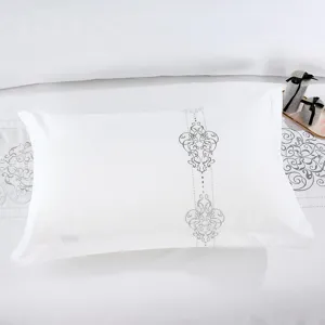 Premium white cotton pillowcase with elegant grey embroidery, ideal for hotel decor.