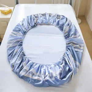 Cotton round fitted sheet with blue stripe pattern, soft and comfortable bedding for home use.