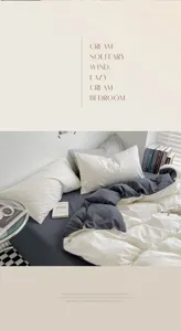 Parure de lit unie en coton lavé et boussolé avec housse de couette au design bicolore élégant.