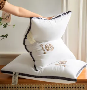 Hotel quality white bed pillow set with embroidery details for comfortable home sleep support