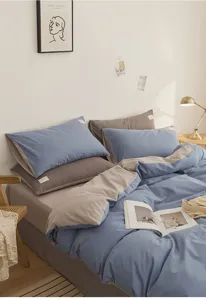 Detailed view of the cotton bedding set, featuring soft blue and grey dual-color fabric texture.