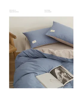 Cotton bedding set with dual-color duvet cover and pillowcases for comfortable bedroom decor.
