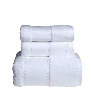 Juego de toallas de bano de algodon blanco para hotel, gruesas y muy absorbentes.