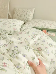 Floral bedding detail, soft cotton duvet cover with cute flower pattern for bedroom decor.