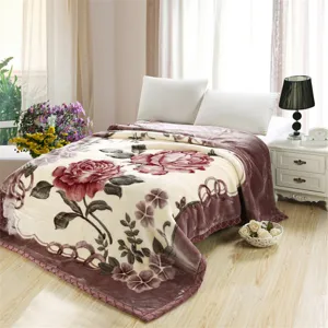 Detail view of winter warm Raschel plush blanket featuring elegant rose floral pattern.