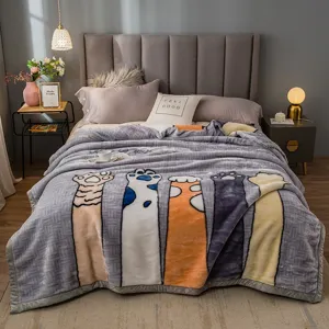 Thick fleece winter blanket with cute cat paw print, warm and cozy for bedroom home decor.