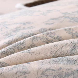 Cotton linen buckwheat pillow cover with elegant blue floral print, soft textured fabric detail.
