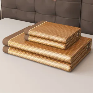 Foldable summer ice cooling mat set with rattan weaving and brown border for student dormitory bed.
