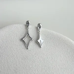 Exquisite asymmetrical star design earrings featuring a sleek liquid silver finish and unique geometric drop.