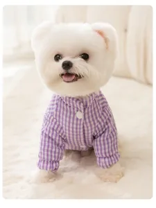Detailed view of cute purple gingham pet winter cotton coat, warm thick dog apparel for pets.