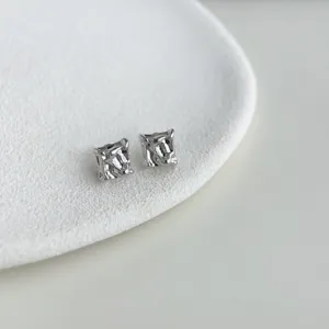 Minimalist irregular silver liquid metal stud earrings detail shot, chic daily jewelry piece.