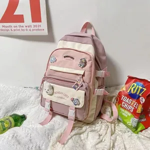 Pink colorblock school backpack with cute badges, multi-pocket casual daily daypack for teens.