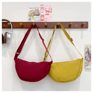 Casual canvas crescent shoulder bag detail, stylish crossbody bag for women daily wear.