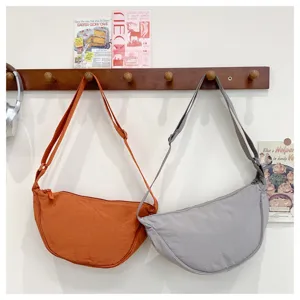 Casual nylon crescent shoulder bag, versatile crossbody dumpling bag for women daily use.