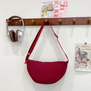 Red canvas crescent shoulder bag for women, stylish casual daily crossbody dumpling bag.