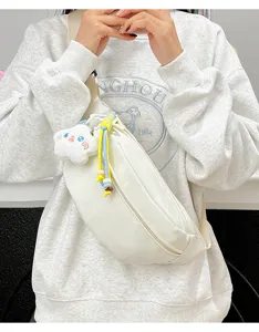 White canvas fanny pack crossbody chest bag with cute plush pendant and colorful strap.