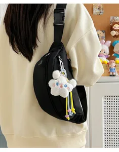 Stylish black chest bag detail, trendy wide strap and cute plush star pendant for women.