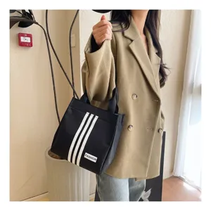 Bolso de mano de lona de estilo coreano con rayas blancas, bolso casual de moda para diario.