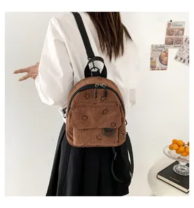 Brauner Cord Mini-Rucksack mit süßer Smiley-Stickerei, vielseitige modische Freizeittasche.