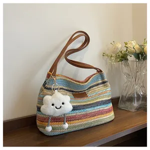 Colorful rainbow woven tote bag with brown leather handles and cute cloud plush pendant