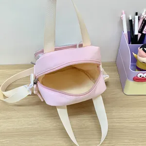 Pink canvas handbag with beige straps, casual shoulder and cute crossbody bag for women.