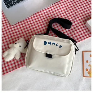 Solid color nylon small crossbody bag, casual cute student shoulder bag with front flap pocket.