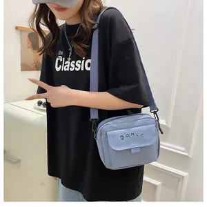 Solid color nylon crossbody bag for women, cute Japanese style casual shoulder bag.