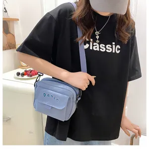 Solid color nylon crossbody bag for women, cute Japanese style casual messenger bag.