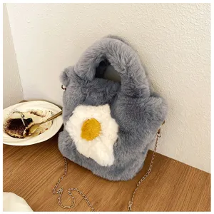 Grey plush fluffy handbag with cute fried egg design and stylish gold chain strap.