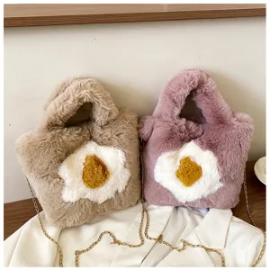 Plush fried egg shoulder bag detail showing fluffy texture, cute design, and gold chain.