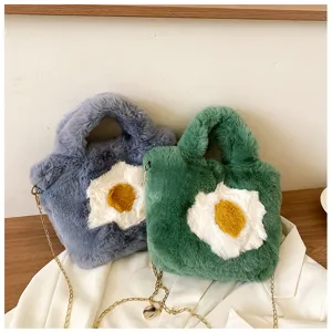 Fluffy fried egg shoulder bag detail showing soft plush texture and chic gold chain.