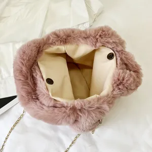 Pink plush crossbody handbag for women, soft fuzzy shoulder bag with chic metal chain strap.