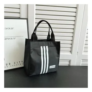 Bolso tote de lona negro para almuerzo con rayas blancas, bolsa de almacenamiento elegante.