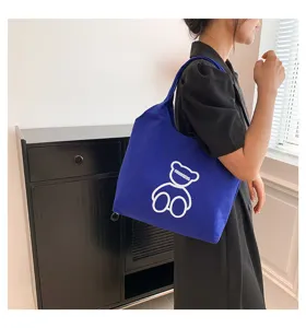 Casual blue canvas tote bag for women, large capacity shoulder bag with cute bear print.