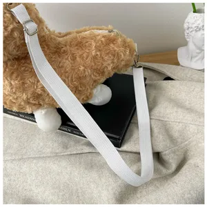 Cute brown curly plush animal crossbody bag detail, soft cute style with white strap.