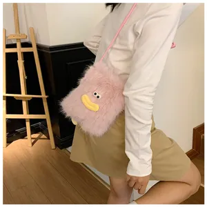 Cute pink plush crossbody bag for women, fluffy mini phone bag with funny cartoon face design.
