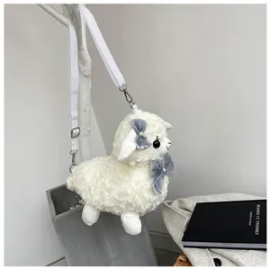 Detailed view of cute plush alpaca crossbody bag with grey bows and adjustable strap in lifestyle scene.