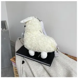 Alpaca plush crossbody bag detail view, showing soft fluffy white fabric, cute bow and strap.