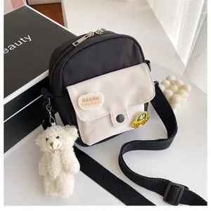 Korean ins canvas crossbody bag with cute bear pendant and fashion patches for daily use.