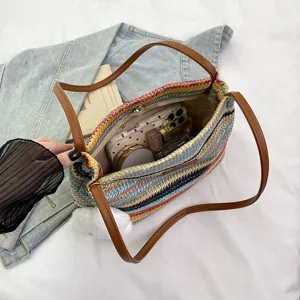 Colorful woven straw shoulder bag for women, stylish summer beach tote with top handle.