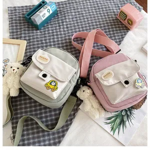 Cute Japanese style canvas crossbody bag for women, sweet small messenger bag with bear pendant.