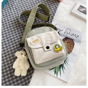 Japanese style canvas crossbody bag for women, cute small messenger bag with bear pendant.