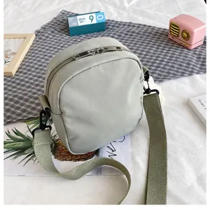 Canvas crossbody shoulder bag detail, casual daily messenger bag with wide strap.