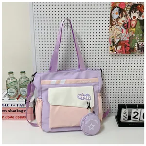 Sac bandoulière colorblock en toile, grand sac fourre-tout étudiant avec détail porte-monnaie.