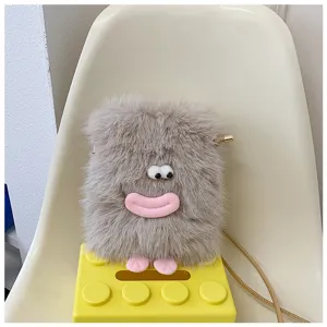 Cute plush crossbody phone bag detail featuring funny lips and eyes design, soft fuzzy texture.